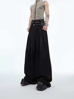 Front view of black pleated straight-leg designer trousers with belt