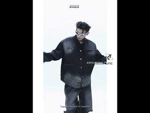 Video showcasing vintage denim jacket with distressed details and architectural silhouette in motion