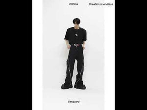 360-degree video showcasing the distressed zip-front flared pants from all angles with movement demonstration