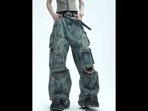 Video showing distressed straight-leg jeans with hand-painted artwork and multiple pockets in motion for urban fashion