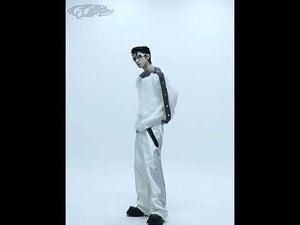 360-degree video showcasing the off-shoulder cable-knit sweater's airplane clasp buttons, drop shoulder design and soft texture