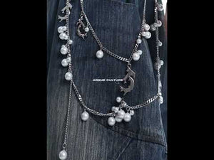 360-degree video showcasing vintage distressed jeans with pearl accents and loose wide leg fit