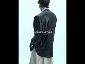 Video showing how the liquid metal textured oversized blazer moves and drapes in streetwear styling