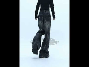 360-degree video showing all angles of vintage distressed wide-leg jeans with handpainted details