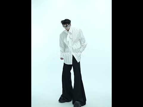 Video showing how to style this genderless oversized white shirt with 3D pleats and shoulder pads