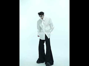 Video showing how to style this genderless oversized white shirt with 3D pleats and shoulder pads