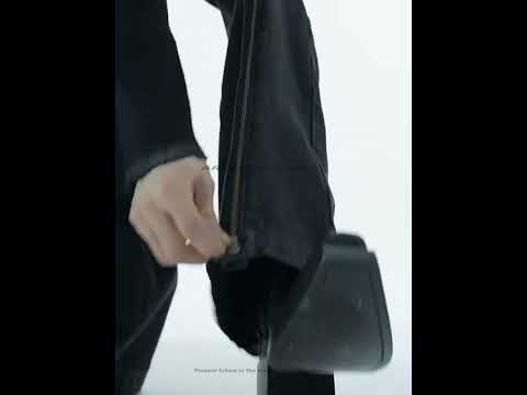 360-degree video showcasing vintage washed flared jeans with distressed details and prominent metal zipper accents