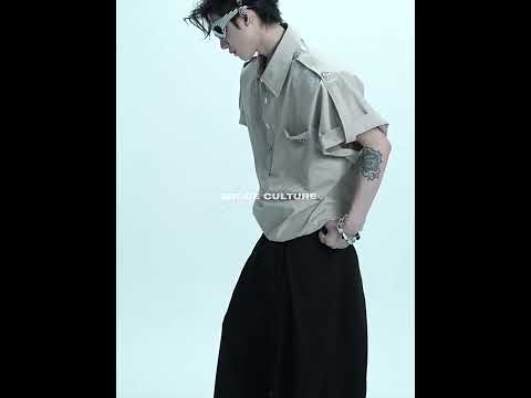 Video demonstration showing the drape and movement of these straight fit twill trousers with pleated details