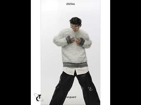 360-degree video showing the minimalist chunky knit sweater with metal trim from all angles