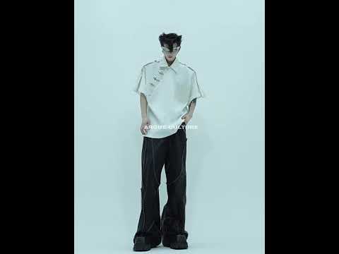 Video demonstrating different styling options for this Chinese-inspired deconstructed polo shirt with metal grommet details