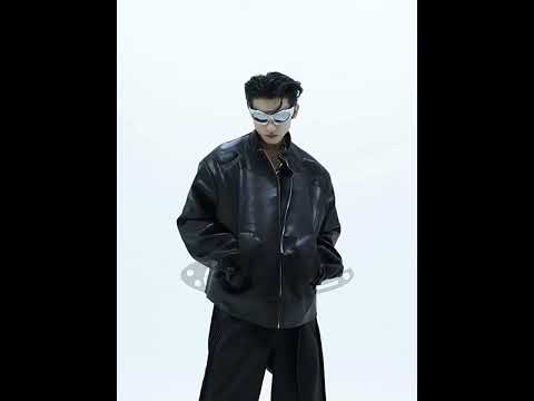 Video showing 360-degree view of deconstructed cropped leather jacket with 3D metal triangle accents