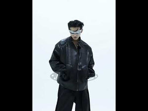 Video showing 360-degree view of deconstructed cropped leather jacket with 3D metal triangle accents