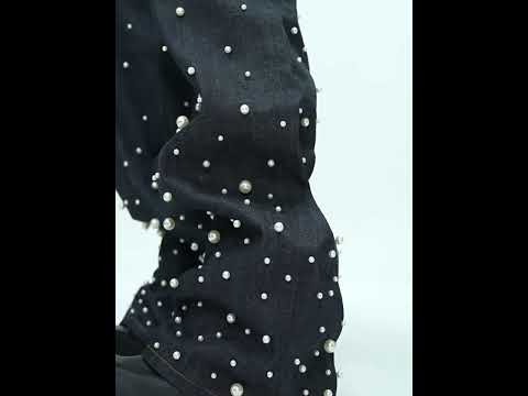 360-degree video showing hand-stitched pearl raw denim jeans with selvedge detail and unique patchwork design