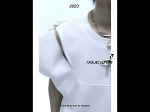 360-degree video showcasing the oversized streetwear top's architectural details and fit