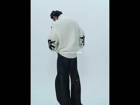 360-degree video showing how this oversized high neck sweater with metal buttons moves and fits