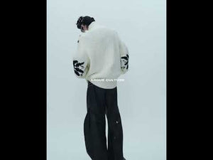 360-degree video showing how this oversized high neck sweater with metal buttons moves and fits
