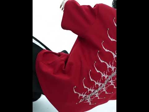 Video showing 360-degree view of snake-eye spine embroidered t-shirt with different styling options for streetwear