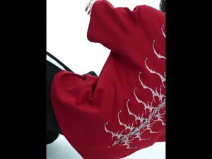 Video showing 360-degree view of snake-eye spine embroidered t-shirt with different styling options for streetwear