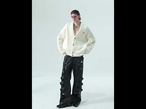 Video showing the heavyweight textured V-neck cardigan in motion, highlighting its loose fit and urban streetwear style