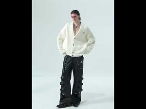 Video showing the heavyweight textured V-neck cardigan in motion, highlighting its loose fit and urban streetwear style