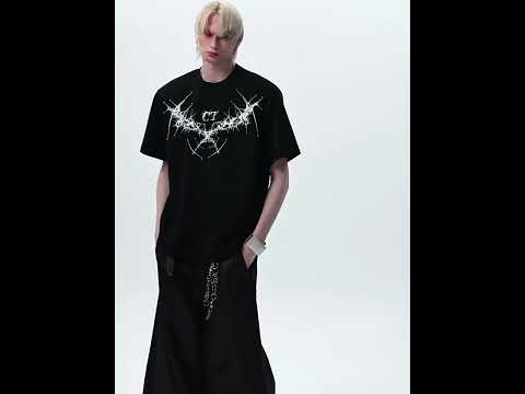 Video showing multiple ways to style the oversized studded embroidered t-shirt for urban streetwear looks