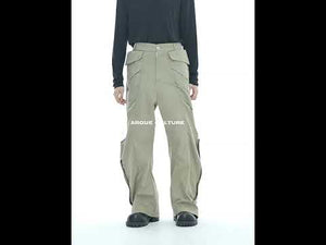 Video demonstrating the fit and movement of these loose fit cargo pants with metal snaps and pleats