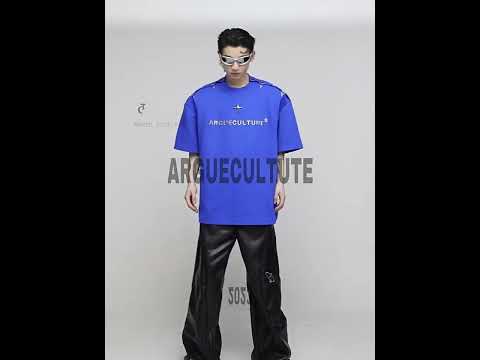 Video showing multiple ways to wear deconstructed metal clip tee with removable shoulder pads