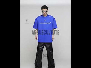 Video showing multiple ways to wear deconstructed metal clip tee with removable shoulder pads