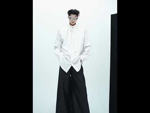 360-degree video showing all angles of the unique patchwork oversized shirt with pleated details