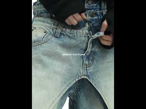 360-degree video showcase of washed blue jeans featuring all distressed details and streetwear design