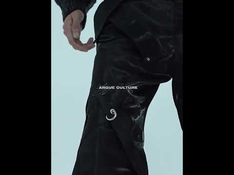 Video demonstrating the fluid movement and architectural silhouette of futuristic liquid-leather pants