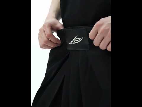 Video showcasing the movement and style of vintage French pleat wide-leg trousers with drop-crotch design