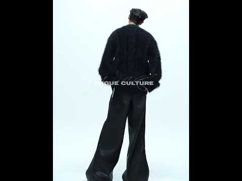 Video demonstration of men's oversized V-neck knit sweater showing 360 view and streetwear styling