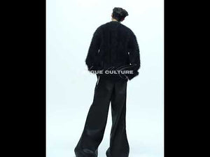 Video demonstration of men's oversized V-neck knit sweater showing 360 view and streetwear styling