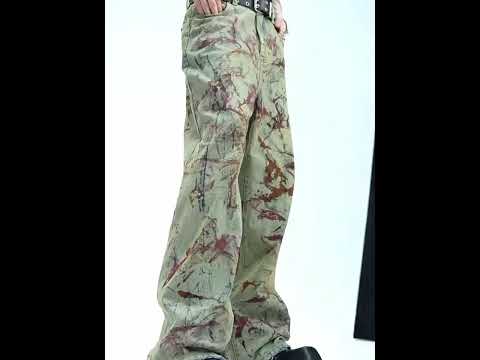 360-degree video showcase of vintage distressed denim jacket with spray paint details and deconstructed design