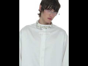 360-degree video showcasing the luxury satin shirt with diamond trim, detachable shoulder pads and pearl accents