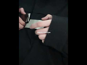 Video showing different ways to style this black oversized jacket with metal buckle details