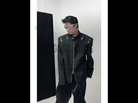 Video showcasing deconstructed metal-clasp blazer bomber jacket with stand collar and shoulder pads in motion