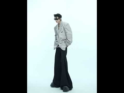Video demonstrating how to wear this deconstructed blazer with liquid-shine fabric for urban fashion looks