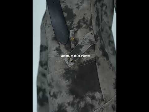360-degree video showcase of distressed wide-leg leather cargo pants with metal buttons and washed finish