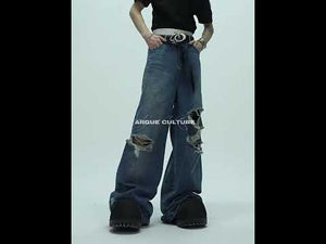 360-degree video showcasing the deconstructed ripped flare jeans with dragon embroidery in motion