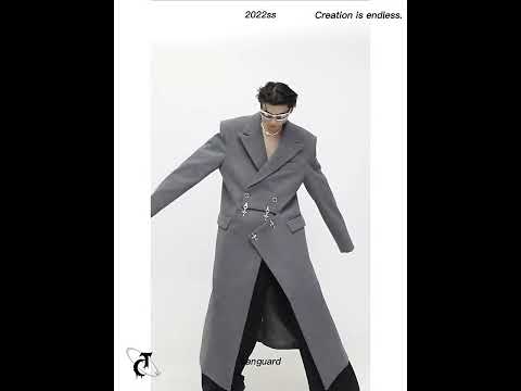 360-degree video showing movement and design details of avant-garde wool coat with metal clasp and shoulder pads