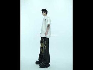 Video showcasing how to wear this deconstructed metal ring oversized tee with streetwear aesthetic