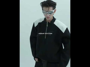 Video showcasing the deconstructed knit sweater with metal zipper and contrast design in motion
