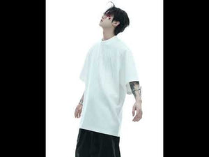 360-degree video showcasing the stylish oversized graphic tee with starburst diamond print from all angles