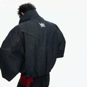 Back view of the boxy fit raw denim jacket with elastic hem
