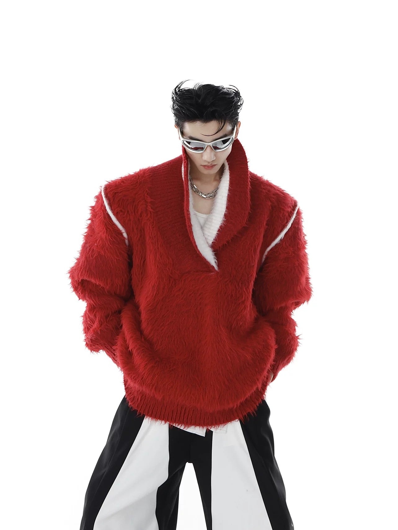 Male model wearing oversized red square neck sweater in street setting