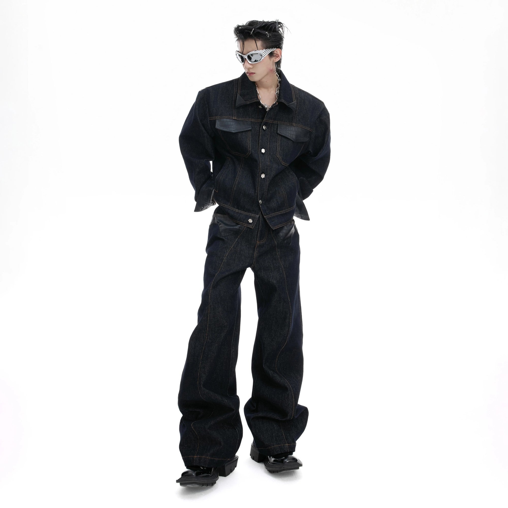 Front view of retro raw denim jacket with crocodile leather patchwork details.