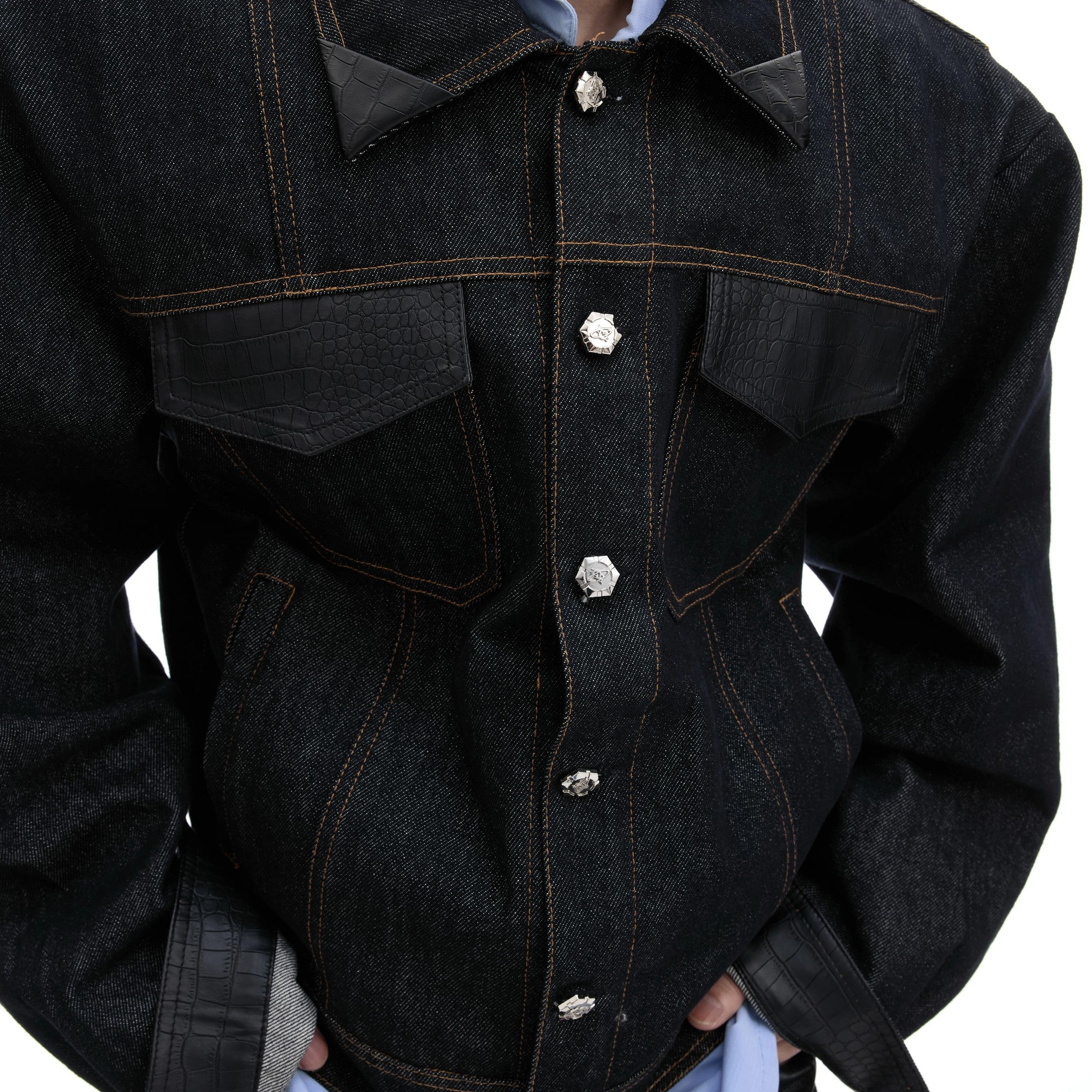 Close-up of matte crocodile leather patchwork on the collar and pocket.