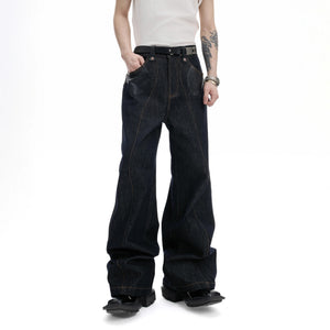 Back view of the boxy cropped raw denim jacket showing structural seams.